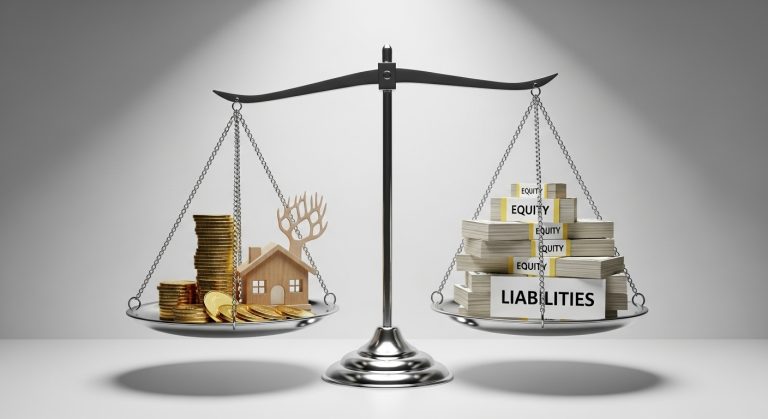 A balanced scale illustrating the accounting equation, with 'Assets' on one side and 'Liabilities + Equity' on the other, representing a company's balance sheet.